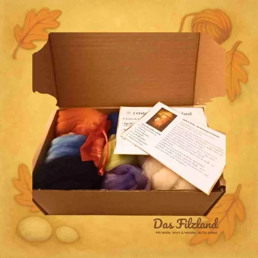 Materialbox geöffnet – Wolle, Noppenfolie und kleine Filzlandkarten als liebevolle Einladung zum Beginnen.“